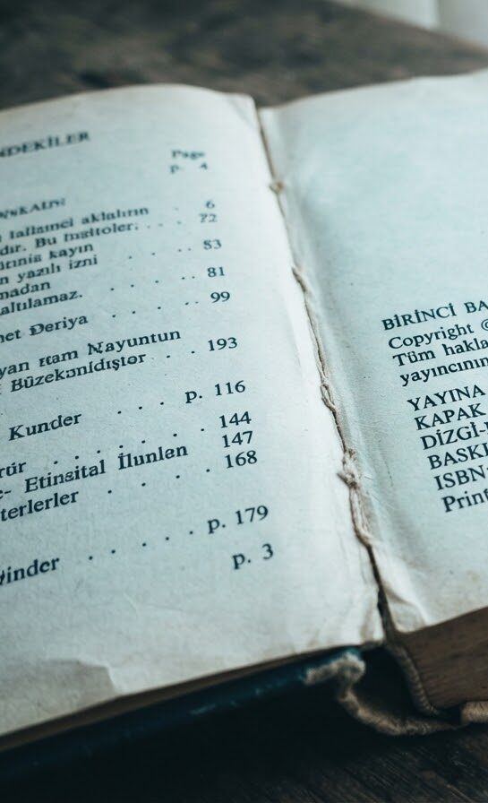 The imprint page of an old book lying open