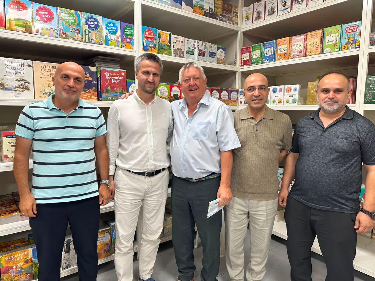 The Kibo Index team with their hosts in a children’s book section