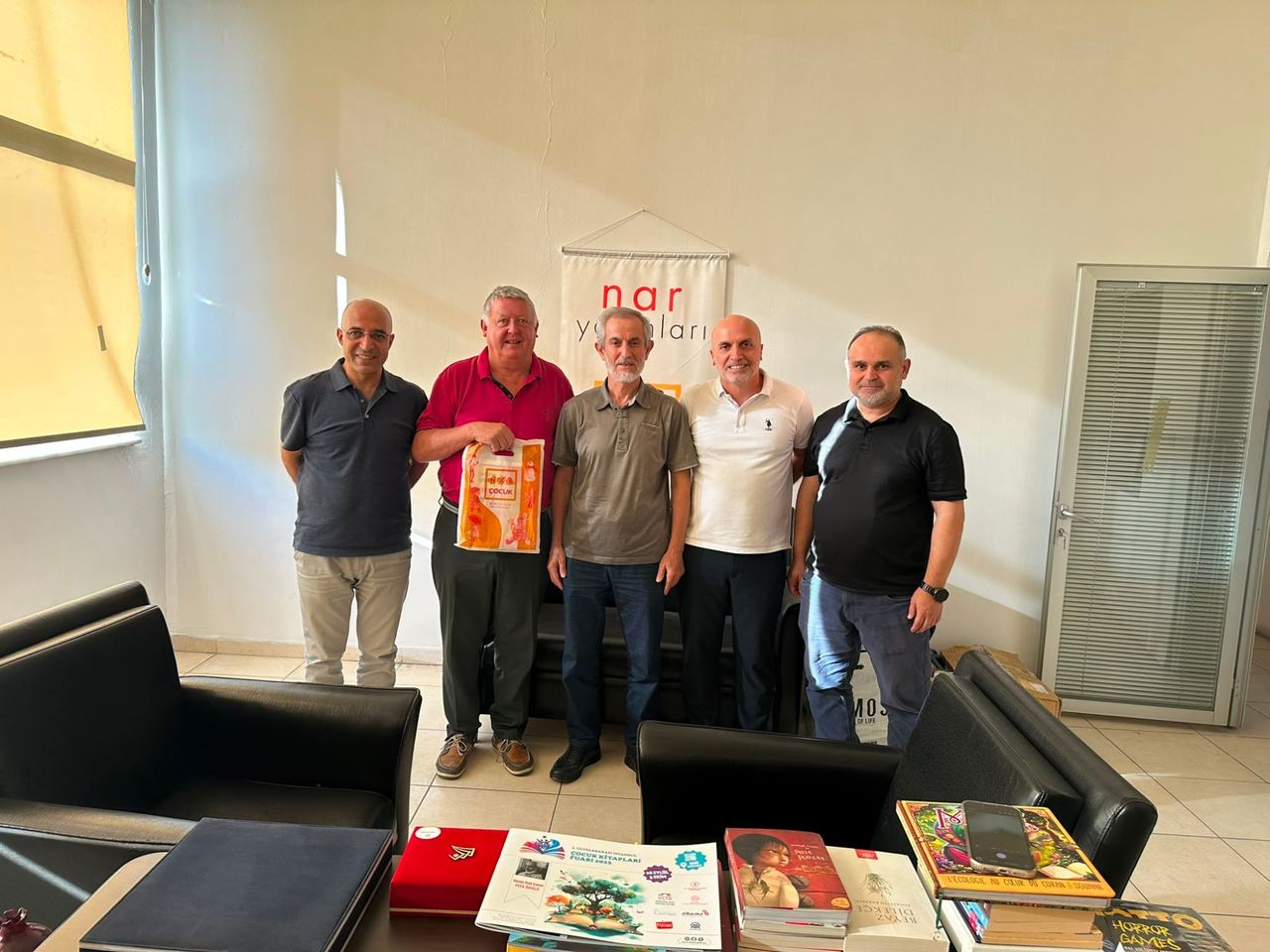 The Kibo Index team with their hosts at a publisher’s office